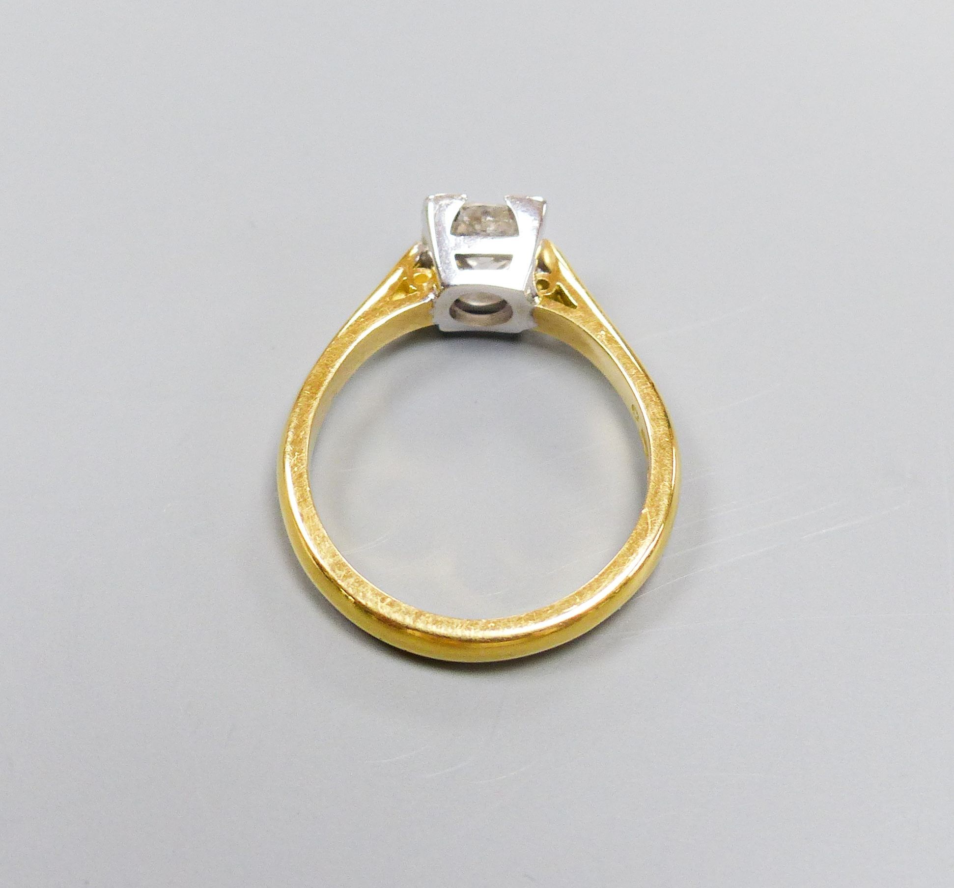 A modern 18ct gild and solitaire diamond ring, size M, gross weight 4.3 grams